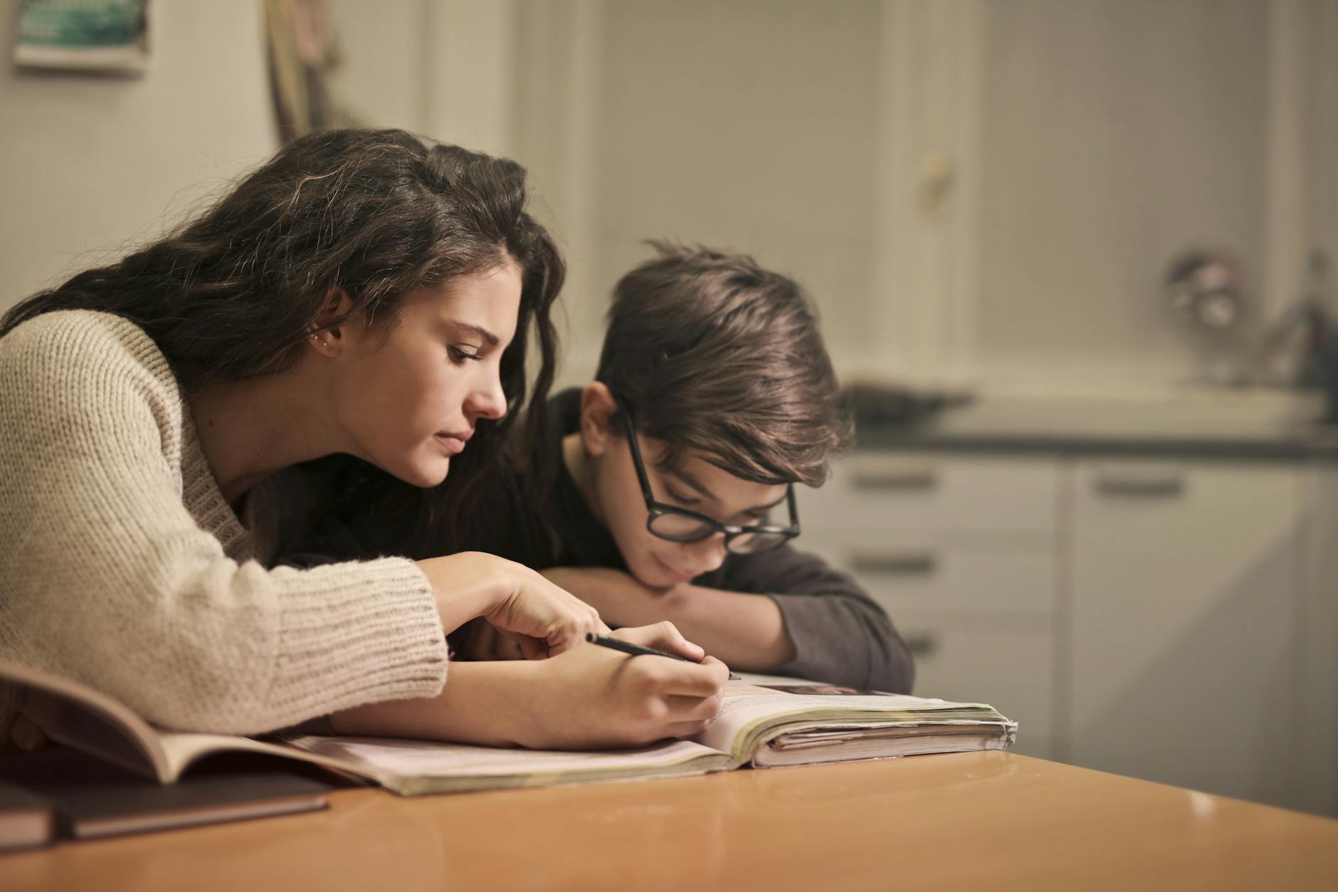 focused students doing homework at home