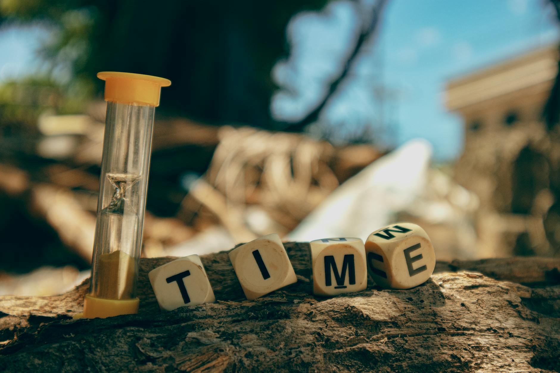 hourglass and wooden letters